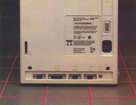 The rear of the Mac. Note the icon labels. The bottom row of connectors is for (from left) the mouse, second floppy disk, printer, modem and speaker